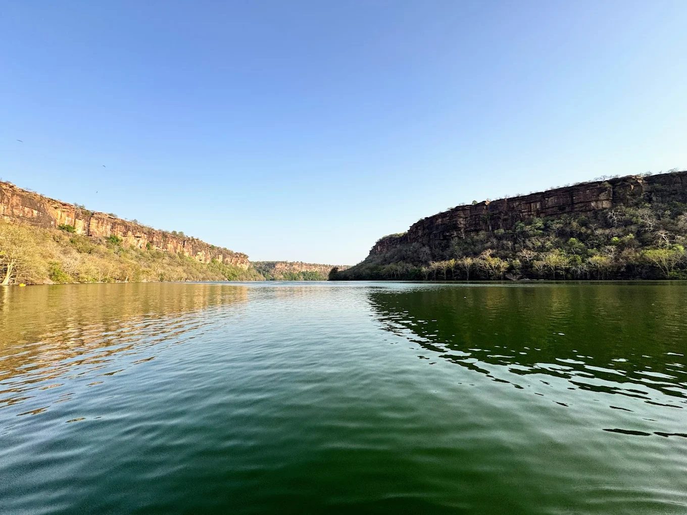 The Chambal River gorge near Kota with limestone cliffs and calm green water